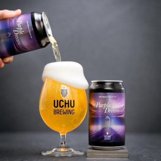 Uchu Brewing Purple Dream beer being poured into a glass with a can of the same beer on a dark background.