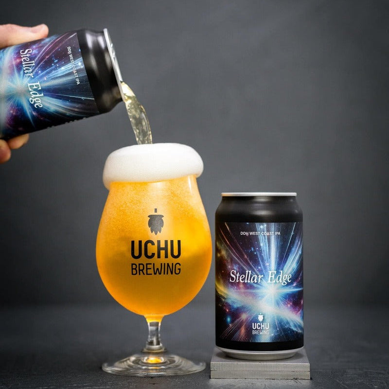 Uchu Brewing Stellar Tide beer being poured into a glass with a can next to it on a dark background