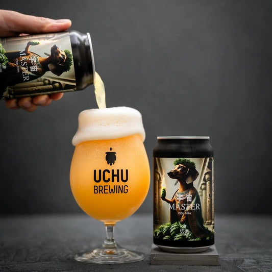 Uchu Brewing beer being poured into a glass with another can on a dark background