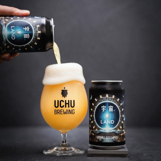 Uchu Brewing beer being poured into a glass with a can on a dark background